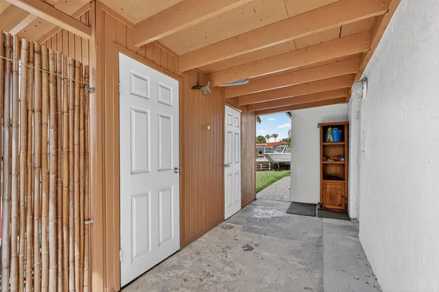 an aerial view of residential houses with outdoor space and swimming pool