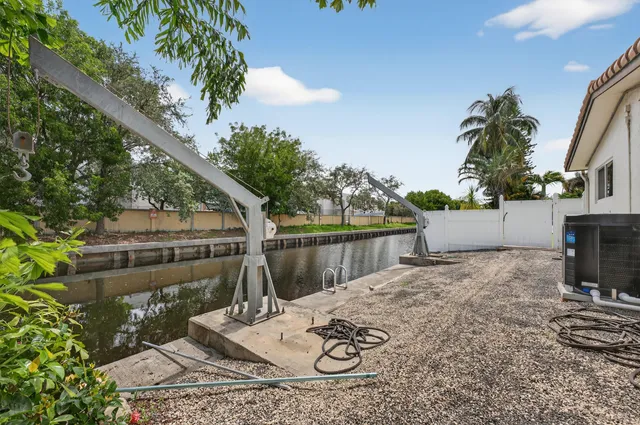 an aerial view of residential houses with outdoor space and swimming pool