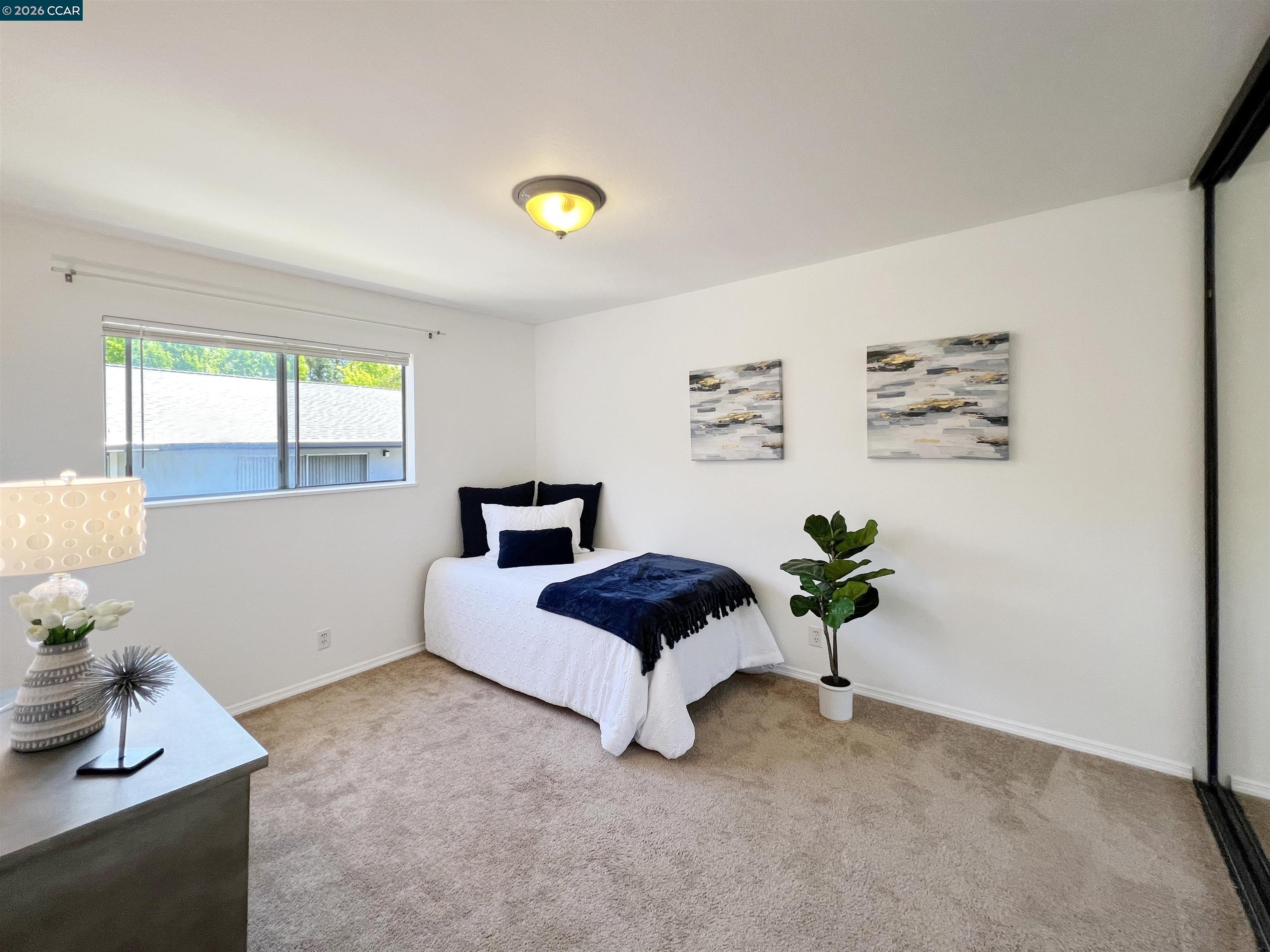 9085 Alcosta Boulevard, Unit 424 San Ramon, CA 94583 - Photo 8 of 21 a living room with furniture and a window