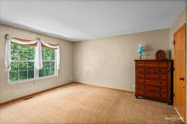 a view of room with furniture and window
