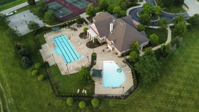 an aerial view of a house with outdoor space