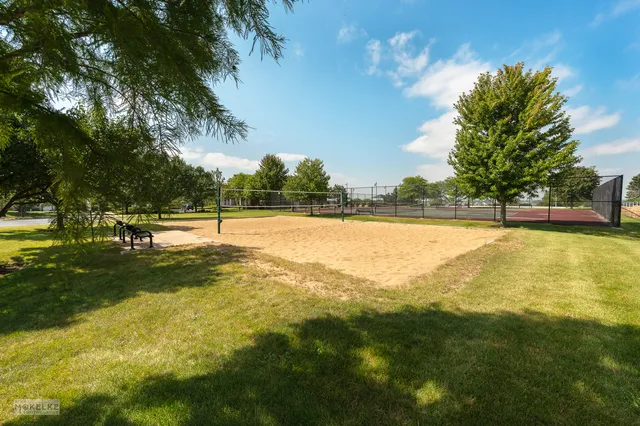a view of a swimming pool with an outdoor space and seating area
