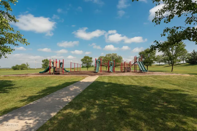 a view of a playground with basketball court