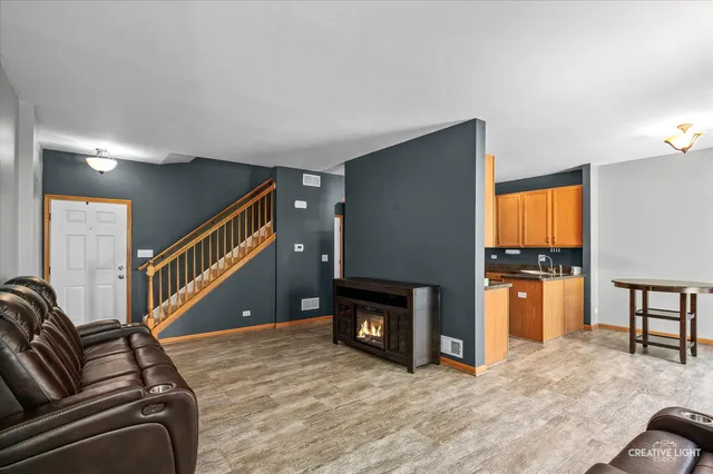 a view of a livingroom with furniture and a fireplace