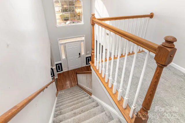a spacious bathroom with a granite countertop sink a mirror a bathtub and shower
