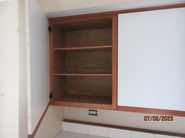 2115 Highwood Road McHenry, IL 60051 - Photo 17 of 31 a view of walk in closet with empty racks