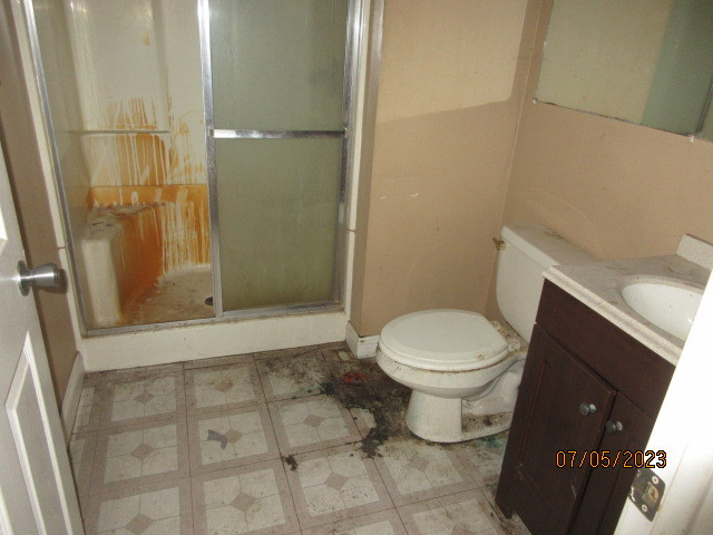 2115 Highwood Road McHenry, IL 60051 - Photo 18 of 31 a bathroom with a toilet and a shower