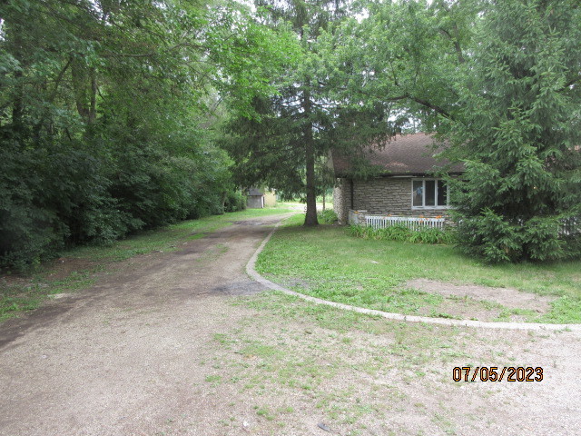 2115 Highwood Road McHenry, IL 60051 - Photo 20 of 31 a view of a house with a backyard