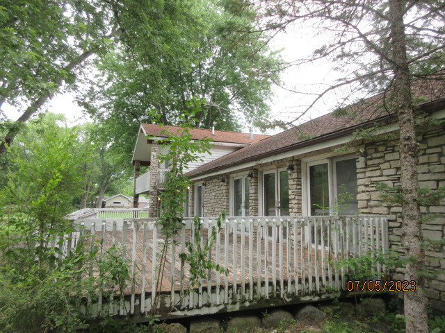 2115 Highwood Road McHenry, IL 60051 - Photo 22 of 31 a front view of a house with a garden