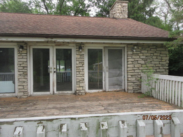 2115 Highwood Road McHenry, IL 60051 - Photo 24 of 31 a view of a house with a wooden door