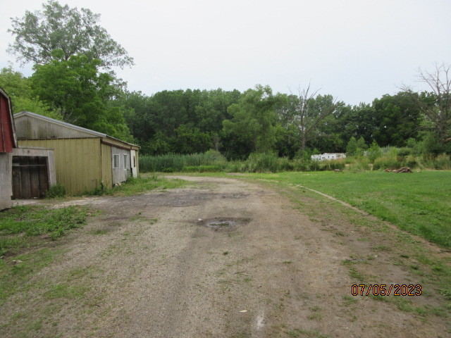 2115 Highwood Road McHenry, IL 60051 - Photo 25 of 31 a view of a backyard with large trees