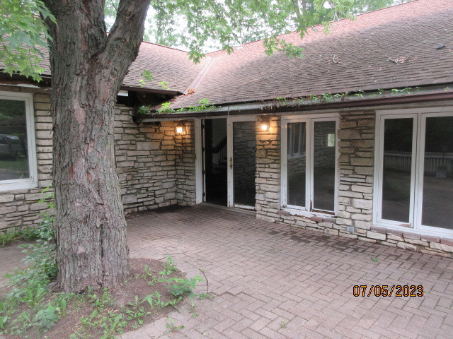 2115 Highwood Road McHenry, IL 60051 - Photo 31 of 31 a view of a brick house with large windows