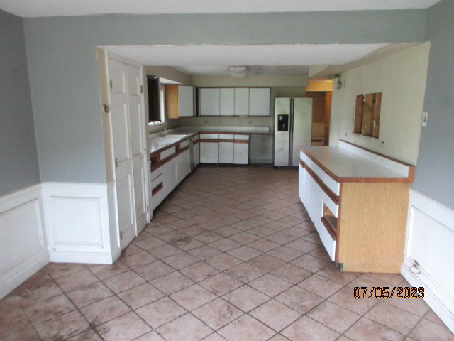2115 Highwood Road McHenry, IL 60051 - Photo 4 of 31 a kitchen with stainless steel appliances granite countertop a refrigerator and a stove