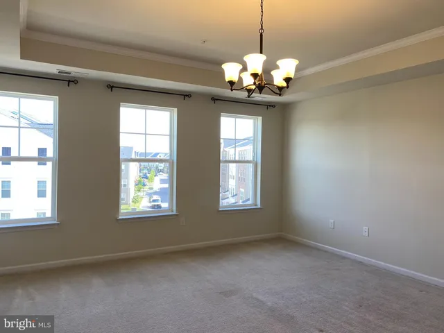 a view of a windows and chandelier in a room