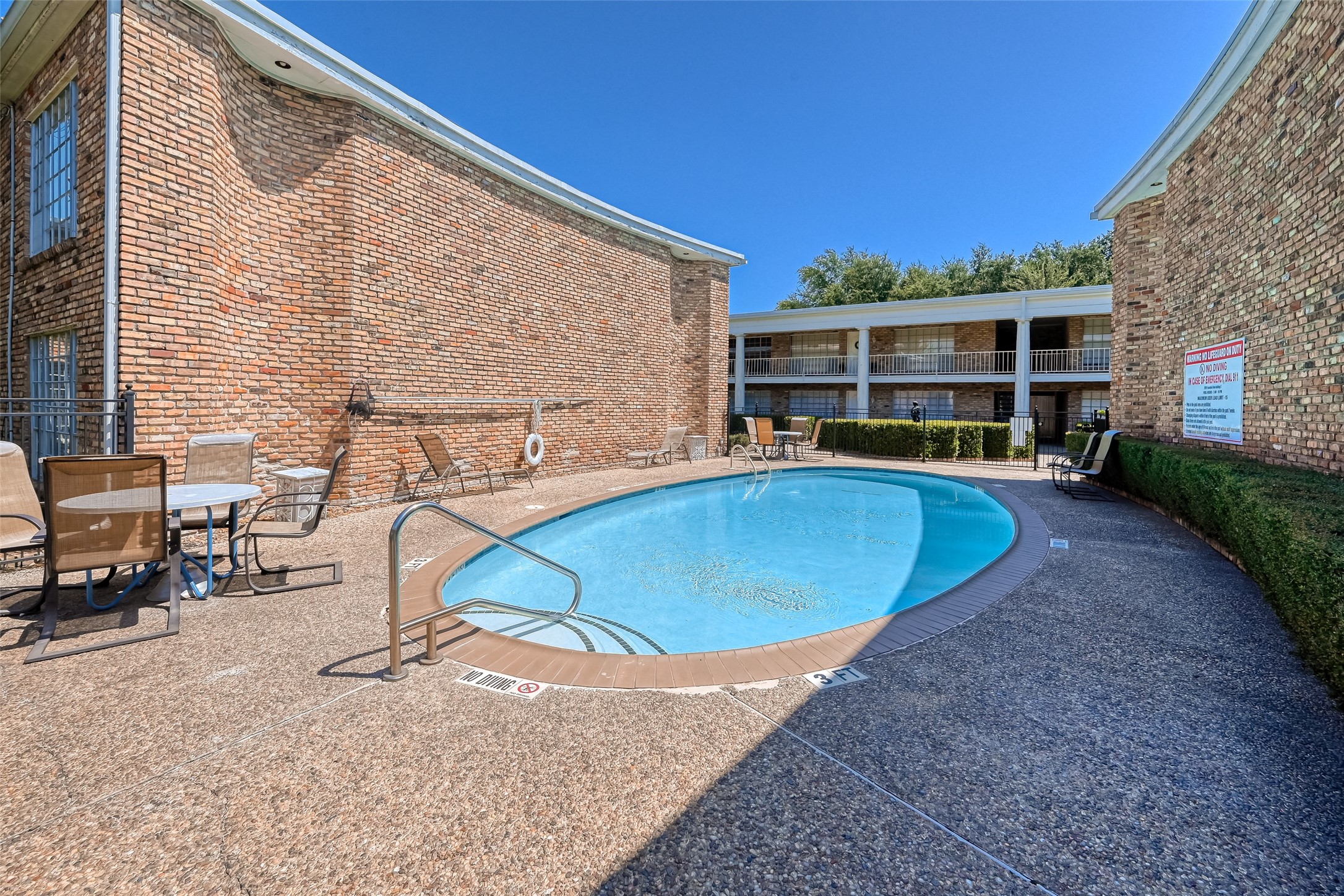 2201 Fountain View Drive, Unit 3 Houston, TX 77057 - Photo 20 of 20 a view of a swimming pool with a lounge chairs