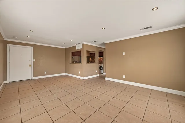 a view of a livingroom with a dishwasher and cabinets