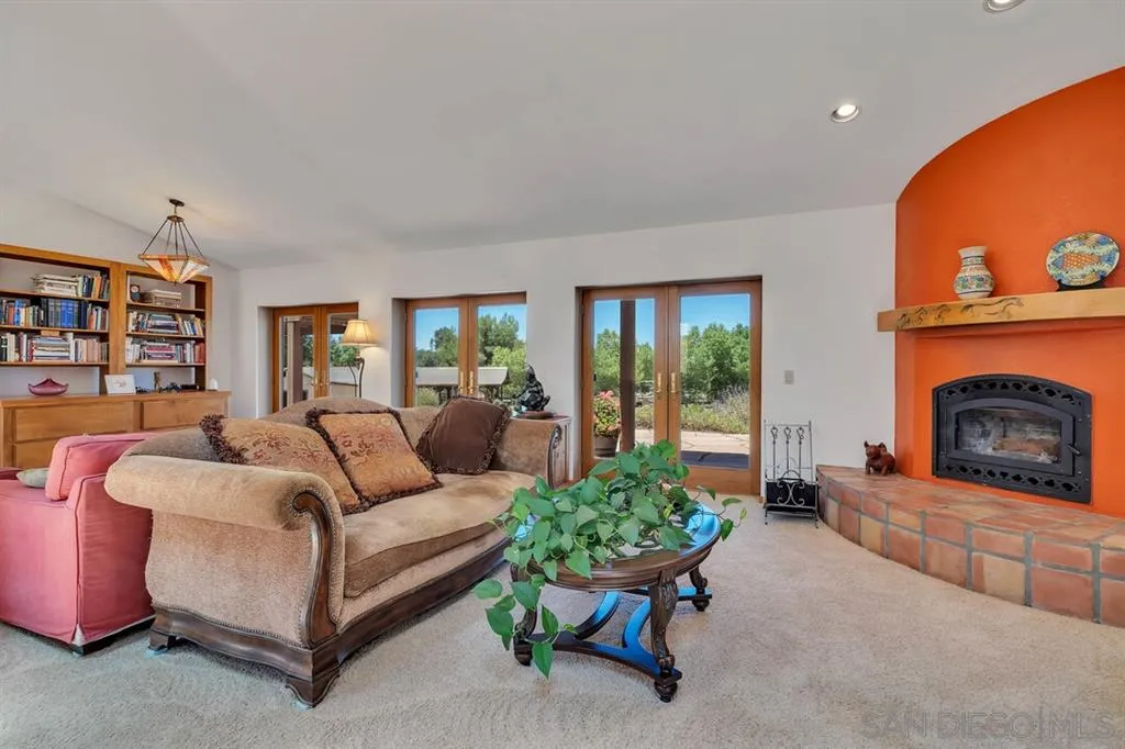 23250 Old Ranch Road Alpine, CA 91901 - Photo 3 of 25 a living room with furniture and a fireplace