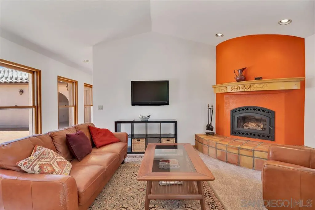 23250 Old Ranch Road Alpine, CA 91901 - Photo 8 of 25 a living room with furniture and a fireplace