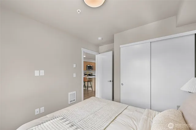 a bedroom with a bed and walk in closet