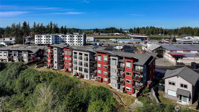 a view of a patio with couches and potted plants