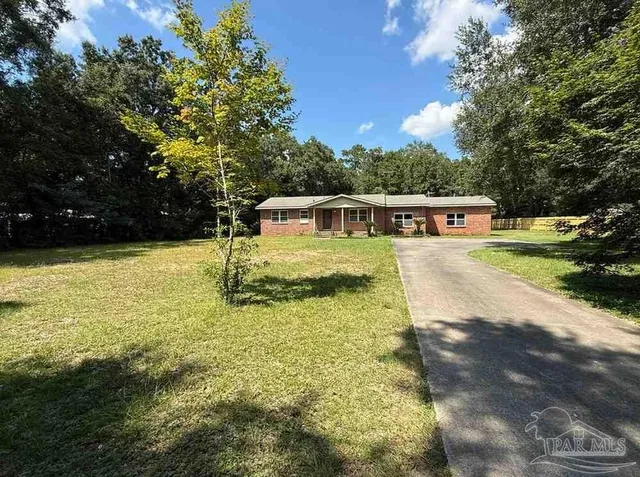 a view of a swimming pool with an outdoor seating
