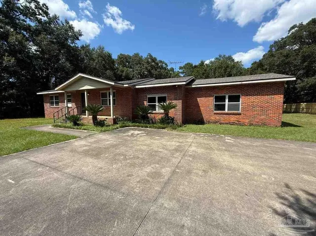 front view of a house with a yard