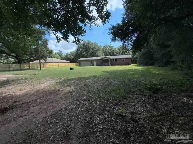 a view of backyard with green space