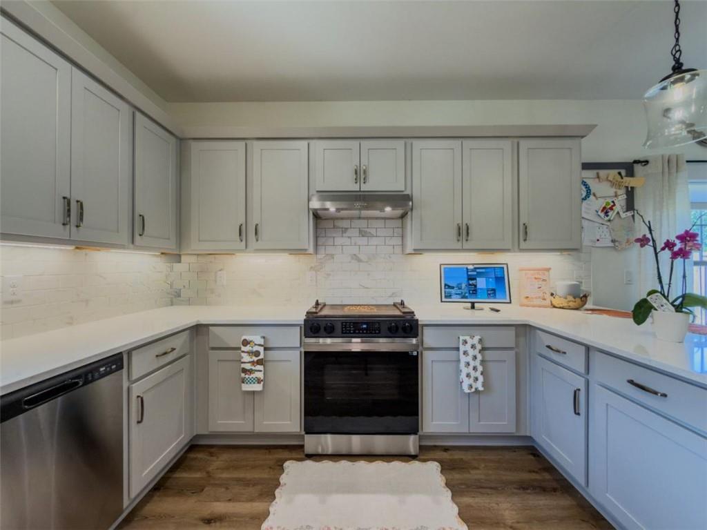 710 Poplar Street Monroe, GA 30655 - Photo 13 of 60 a kitchen with a sink and cabinets