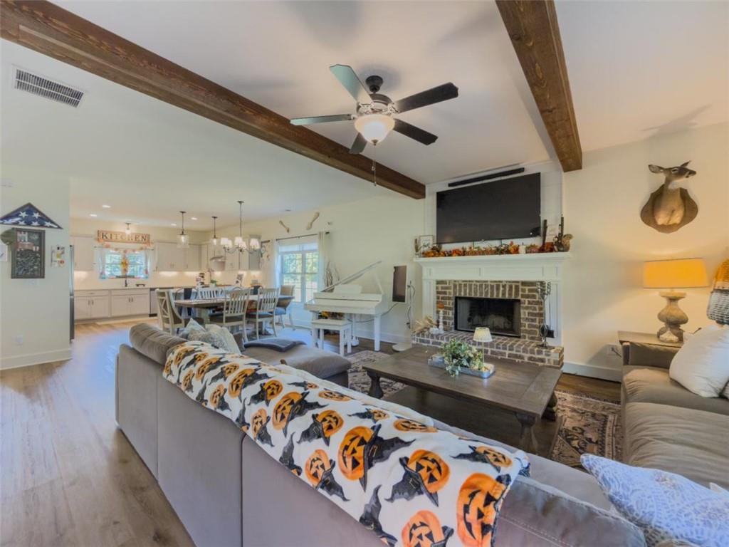 710 Poplar Street Monroe, GA 30655 - Photo 19 of 60 a living room with furniture fireplace and a flat screen tv