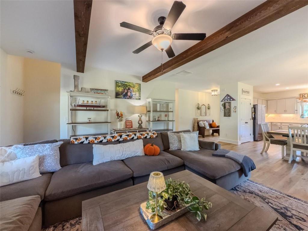 710 Poplar Street Monroe, GA 30655 - Photo 21 of 60 a living room with furniture ceiling fan and a rug