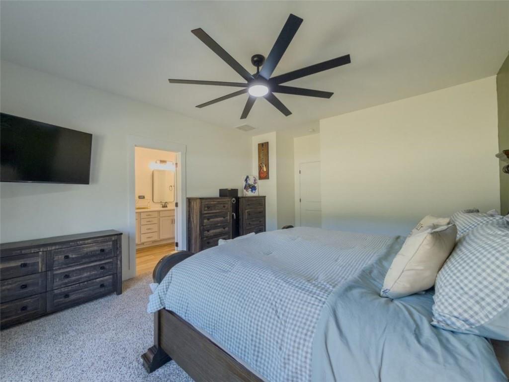 710 Poplar Street Monroe, GA 30655 - Photo 28 of 60 a bed room with a bed a television and dresser