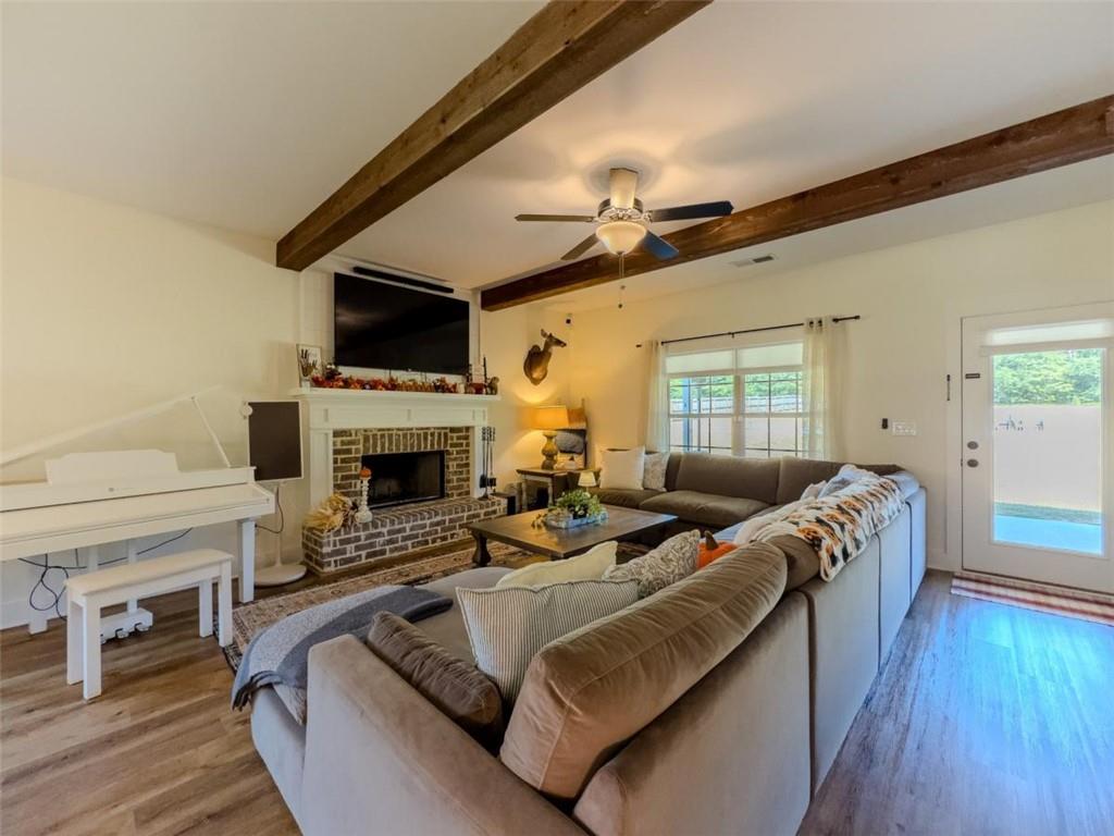 710 Poplar Street Monroe, GA 30655 - Photo 3 of 60 a living room with furniture and a fireplace