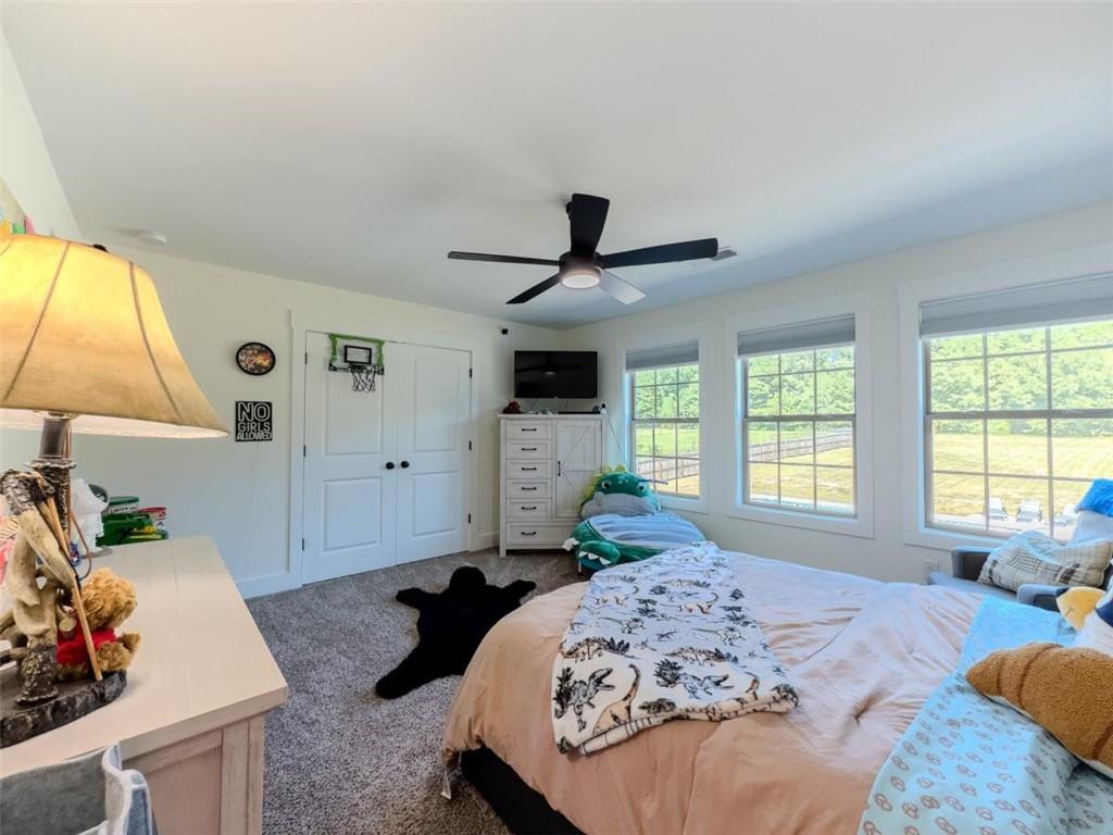 710 Poplar Street Monroe, GA 30655 - Photo 35 of 60 a bedroom with a bed and a window