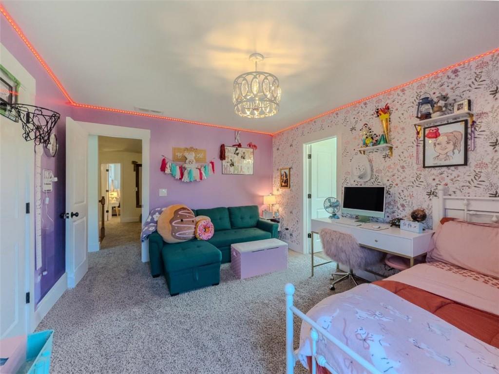 710 Poplar Street Monroe, GA 30655 - Photo 40 of 60 a living room with furniture and a flat screen tv