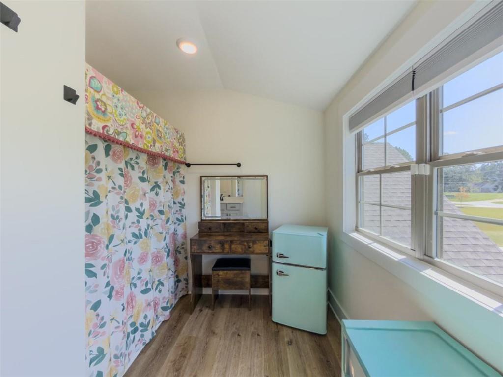 710 Poplar Street Monroe, GA 30655 - Photo 43 of 60 a living room with furniture and a wooden floor