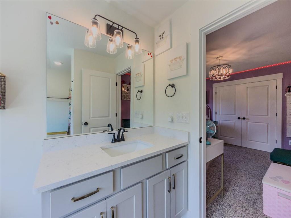 710 Poplar Street Monroe, GA 30655 - Photo 44 of 60 a bathroom with a sink a toilet and shower