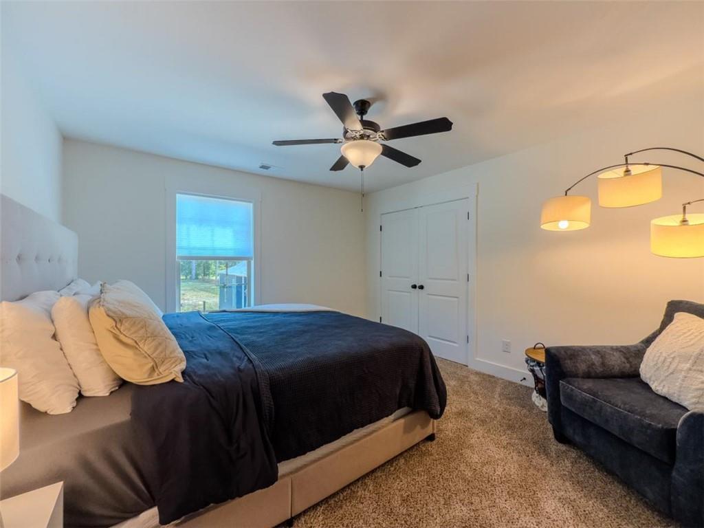 710 Poplar Street Monroe, GA 30655 - Photo 45 of 60 a bedroom with a bed and window