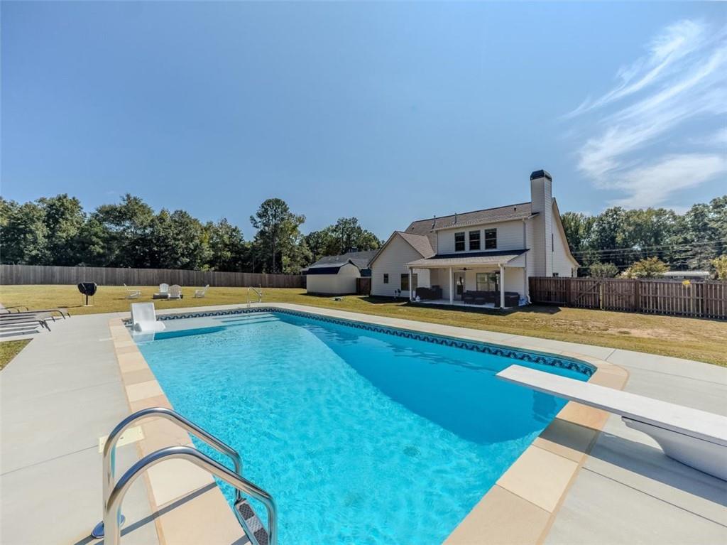 710 Poplar Street Monroe, GA 30655 - Photo 51 of 60 a view of swimming pool with outdoor seating and plants