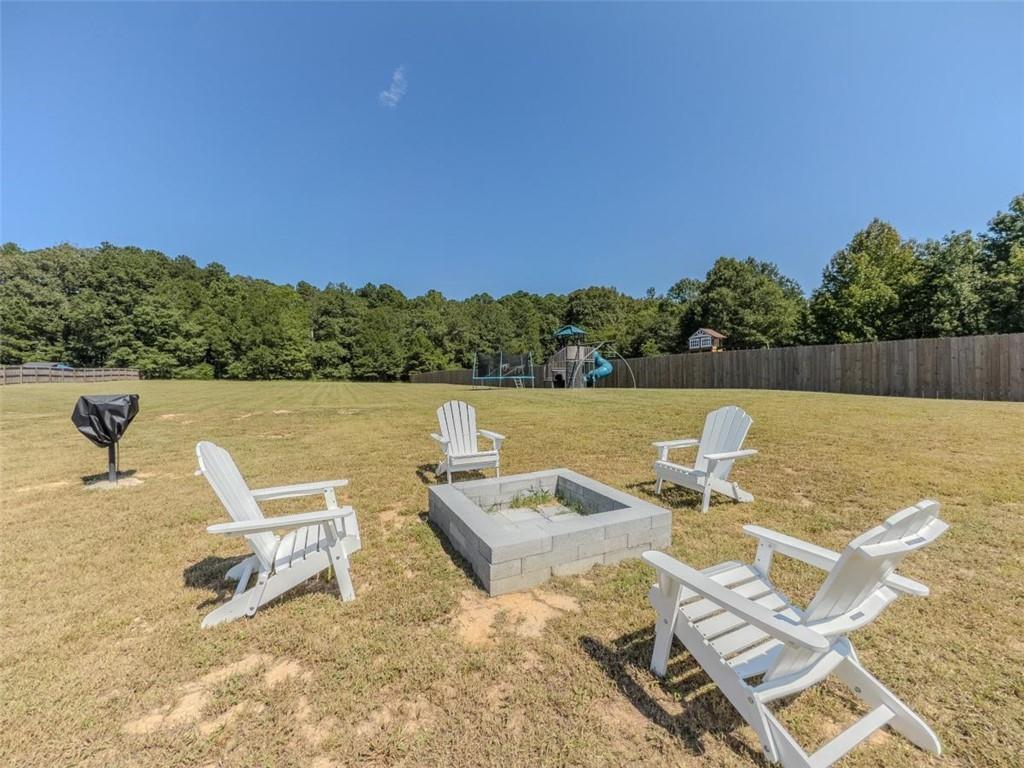 710 Poplar Street Monroe, GA 30655 - Photo 53 of 60 a view of a lake with couches in the patio