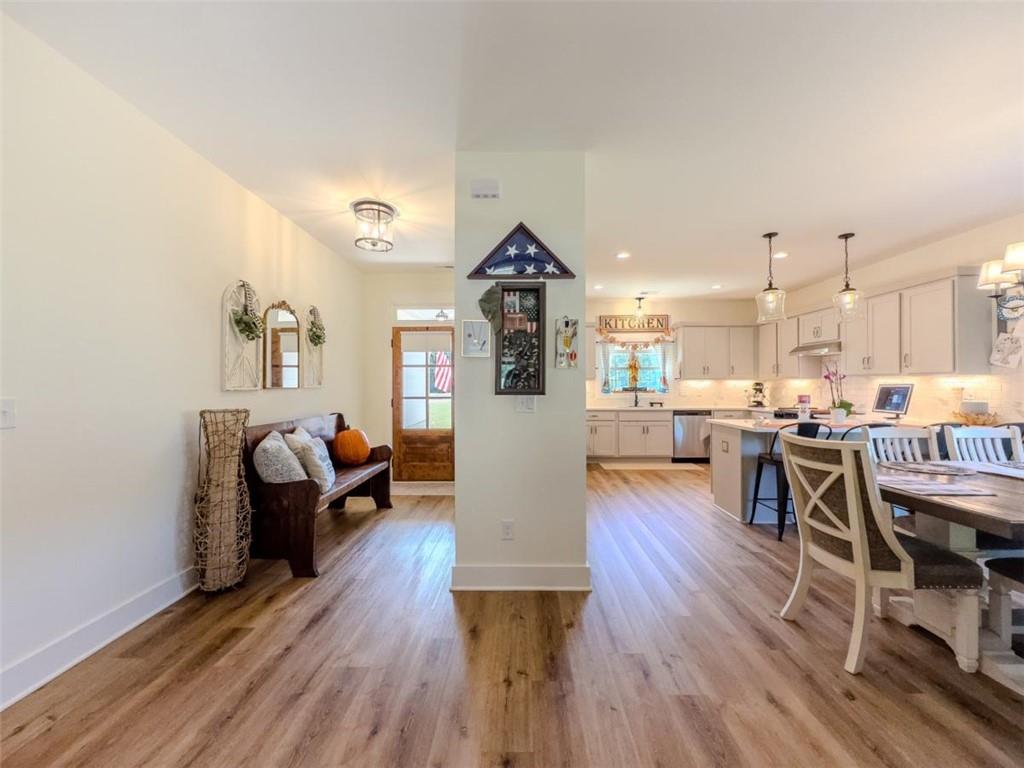 710 Poplar Street Monroe, GA 30655 - Photo 9 of 60 a living room with furniture and a wooden floor