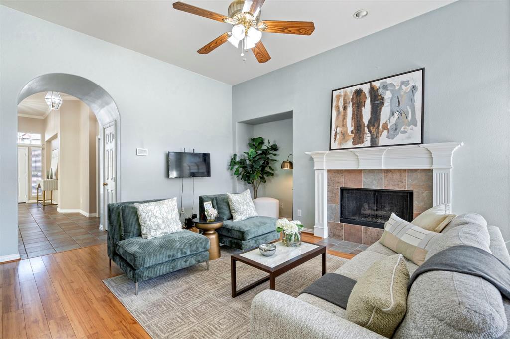 1105 Lamplight Way Allen, TX 75013 - Photo 12 of 40 a living room with furniture and a fireplace