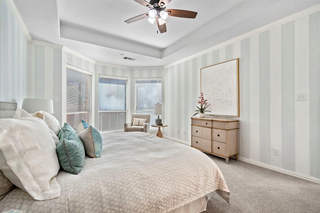 1105 Lamplight Way Allen, TX 75013 - Photo 23 of 40 a bedroom with a bed and a dresser