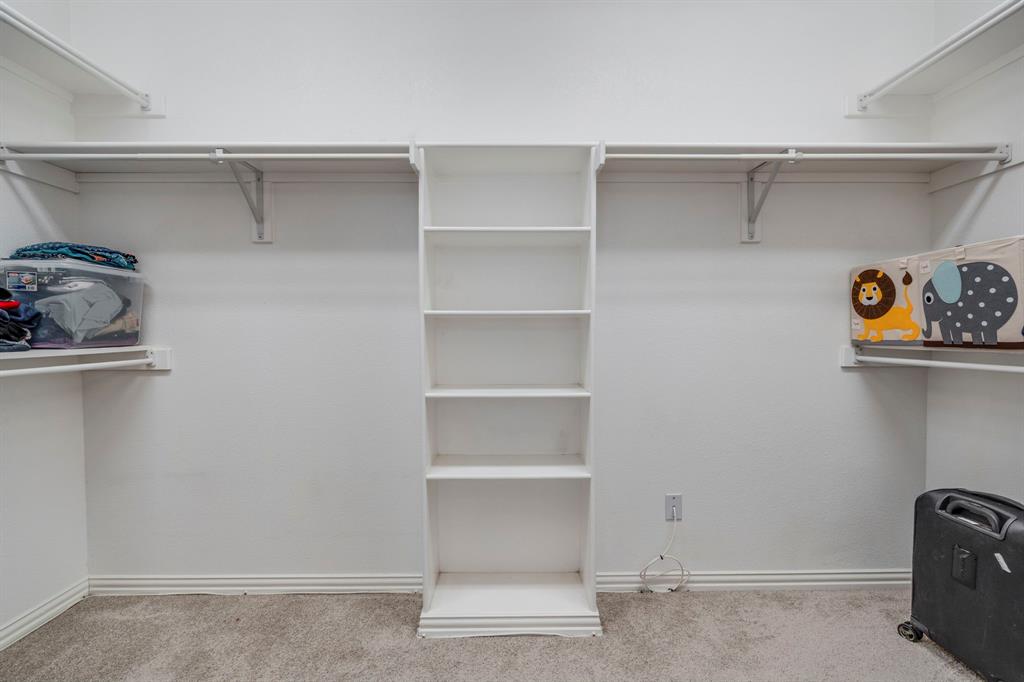 1105 Lamplight Way Allen, TX 75013 - Photo 26 of 40 a view of walk in closet with empty racks
