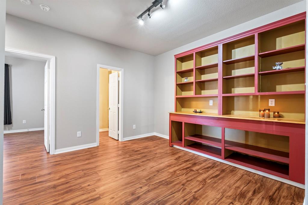 1105 Lamplight Way Allen, TX 75013 - Photo 29 of 40 a view of room with window and wooden floor