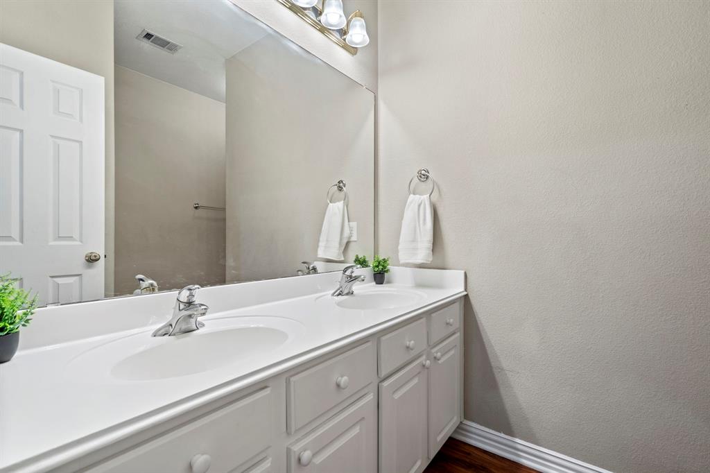 1105 Lamplight Way Allen, TX 75013 - Photo 32 of 40 a bathroom with a sink and a mirror