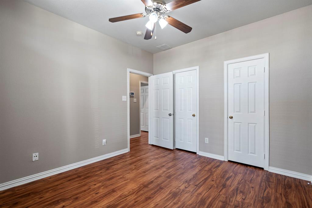 1105 Lamplight Way Allen, TX 75013 - Photo 38 of 40 a view of an empty room with wooden floor