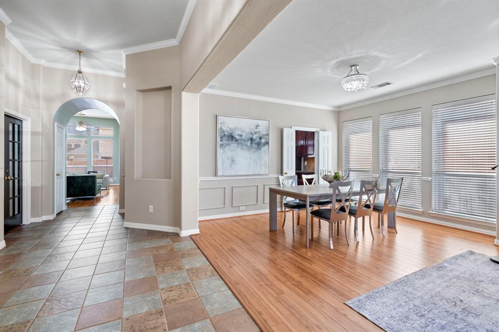 1105 Lamplight Way Allen, TX 75013 - Photo 4 of 40 a view of a dining room with furniture and wooden floor