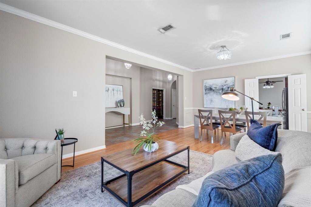1105 Lamplight Way Allen, TX 75013 - Photo 7 of 40 a living room with furniture and wooden floor