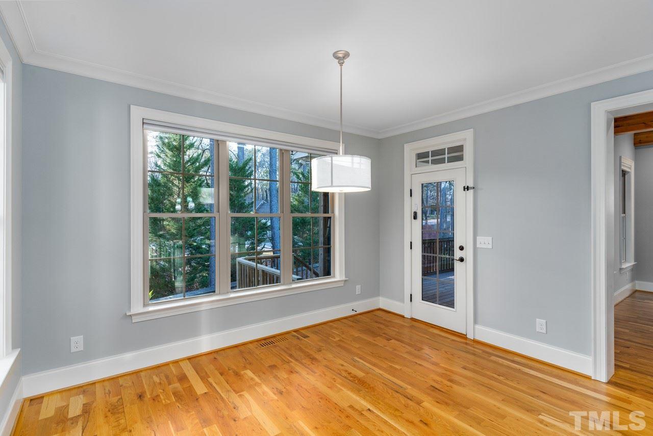 8505 Wynhurst Court Raleigh, NC 27613 - Photo 15 of 30 a view of an empty room with a window and kitchen view