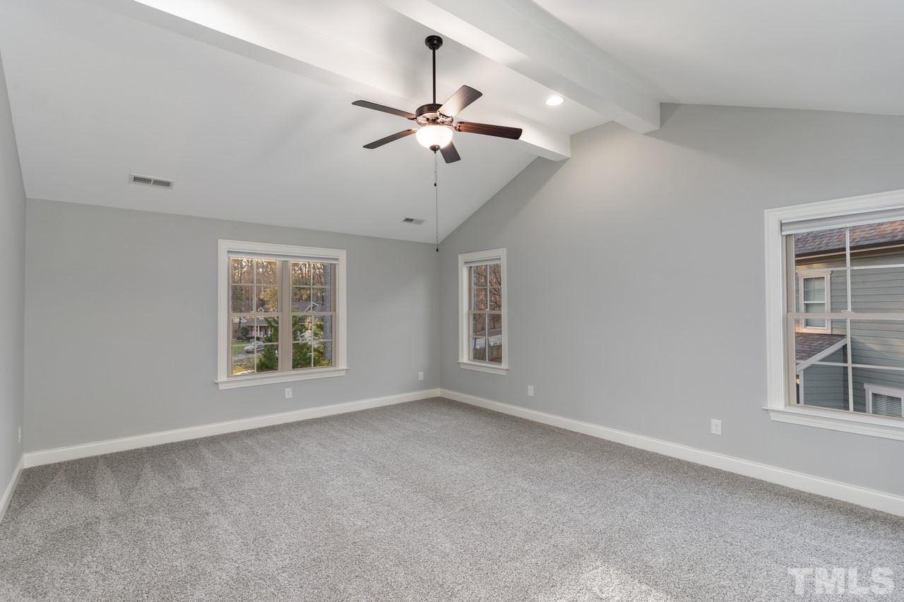 8505 Wynhurst Court Raleigh, NC 27613 - Photo 20 of 30 an empty room with windows and ceiling fan